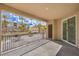 Balcony overlooking manicured landscaping with palm trees and well-maintained buildings at 2555 Hampton Rd # 4204, Henderson, NV 89052