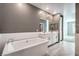 Bright bathroom featuring tiled floors, soaking tub and double sinks at 2555 Hampton Rd # 4204, Henderson, NV 89052