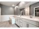 Bathroom with tiled floor, tiled walls, soaking tub and double sinks at 2555 Hampton Rd # 4204, Henderson, NV 89052