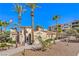 Community clubhouse with desert landscaping, tile roof, sidewalk, and an American flag at 2555 Hampton Rd # 4204, Henderson, NV 89052