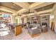 Well-appointed common area with ample seating, a large stone bar, fireplace, and stylish decorations at 2555 Hampton Rd # 4204, Henderson, NV 89052