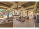 Upscale common area featuring a fireplace, bar seating, comfortable sofas, and beautiful pool views at 2555 Hampton Rd # 4204, Henderson, NV 89052