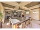 Stylish common area with a large stone bar, seating, fireplace, ceiling fans, and modern decor at 2555 Hampton Rd # 4204, Henderson, NV 89052