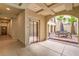 Hallway showcasing an elevator, and an archway view to a courtyard featuring comfortable outdoor seating at 2555 Hampton Rd # 4204, Henderson, NV 89052