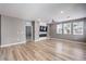 Living room featuring a modern fireplace and faux wood floors at 2555 Hampton Rd # 4204, Henderson, NV 89052