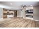 Spacious living room with hard wood floors, ceiling fan and modern fireplace and TV at 2555 Hampton Rd # 4204, Henderson, NV 89052