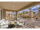 Inviting covered patio featuring stylish seating, offering a perfect outdoor relaxation and neighborhood views at 2555 Hampton Rd # 4204, Henderson, NV 89052