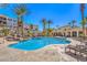 Beautiful community pool area with ample seating and lush landscaping, perfect for relaxation at 2555 Hampton Rd # 4204, Henderson, NV 89052