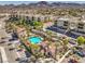 Community pool highlighted by palm trees and manicured landscaping for relaxation at 2555 Hampton Rd # 4204, Henderson, NV 89052