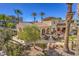 Charming poolside seating area with tile roofing and palm trees, ideal for entertaining and enjoying outdoor living at 2555 Hampton Rd # 4204, Henderson, NV 89052