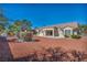 Spacious backyard featuring desert landscaping with stone ground cover and a patio at 2628 Showcase Dr, Las Vegas, NV 89134