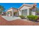 Backyard patio area with a covered porch and lush landscaping surrounding the home at 2628 Showcase Dr, Las Vegas, NV 89134