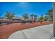 Landscaped backyard area with stone ground cover and a block perimeter wall at 2628 Showcase Dr, Las Vegas, NV 89134