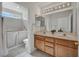 Bathroom featuring double sinks, updated fixtures, and a walk-in tub at 2628 Showcase Dr, Las Vegas, NV 89134