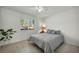 Comfortable bedroom with a large window offering plenty of natural light and tile flooring at 2628 Showcase Dr, Las Vegas, NV 89134