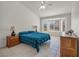 Comfortable bedroom with a ceiling fan, and a large window, with tile flooring at 2628 Showcase Dr, Las Vegas, NV 89134