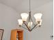 Close up of dining room chandelier with a view of adjacent display case at 2628 Showcase Dr, Las Vegas, NV 89134