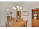 Cozy dining area with wooden table set, chandelier, and built-in display cabinet at 2628 Showcase Dr, Las Vegas, NV 89134