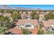 Scenic view of a home featuring a backyard patio, desert landscaping, and a beautiful neighborhood against a mountain backdrop at 2628 Showcase Dr, Las Vegas, NV 89134