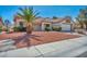 Attractive single-story house with desert landscaping and a tiled roof at 2628 Showcase Dr, Las Vegas, NV 89134