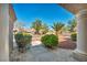 Inviting front porch area with manicured landscaping, and decorative stone accents, offering a glimpse of the neighborhood at 2628 Showcase Dr, Las Vegas, NV 89134