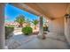 Inviting front porch area with manicured landscaping, and decorative stone accents, offering a glimpse of the neighborhood at 2628 Showcase Dr, Las Vegas, NV 89134