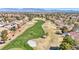 Scenic aerial shot of a meticulously groomed golf course cutting through a community with well-maintained homes at 2628 Showcase Dr, Las Vegas, NV 89134