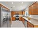 Spacious kitchen with stainless steel appliances, light countertops and wood cabinets at 2628 Showcase Dr, Las Vegas, NV 89134