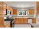 Kitchen featuring stainless steel appliances, bright natural light, and tile flooring at 2628 Showcase Dr, Las Vegas, NV 89134