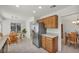 Bright kitchen with stainless steel fridge and adjacent breakfast nook and dining room at 2628 Showcase Dr, Las Vegas, NV 89134