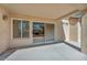 Covered backyard patio with exterior stucco walls and concrete flooring at 2628 Showcase Dr, Las Vegas, NV 89134