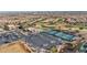 Vibrant community featuring tennis courts, a pool, and a clubhouse, surrounded by lush landscaping and ample parking at 2628 Showcase Dr, Las Vegas, NV 89134