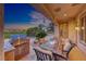 Covered patio featuring a built-in grill, an outdoor dining table with seating, and lush green golf course views at 2872 Sumter Valley Cir, Henderson, NV 89052