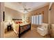 Cozy bedroom with plush carpets, ceiling fan and natural light from plantation shutters at 2872 Sumter Valley Cir, Henderson, NV 89052