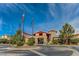 Exterior shot of the welcoming community clubhouse with flags and landscaping at 2872 Sumter Valley Cir, Henderson, NV 89052