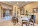 Elegant dining area with granite countertop, bar seating, and decorative accents at 2872 Sumter Valley Cir, Henderson, NV 89052
