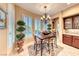 Cozy breakfast nook features a chandelier, plantation shutters, and outdoor views at 2872 Sumter Valley Cir, Henderson, NV 89052