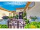 An inviting front patio with black iron gate and wrought iron accents at 2872 Sumter Valley Cir, Henderson, NV 89052