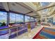 Bright hallway with beautiful flooring, railing and expansive windows with golf course views at 2872 Sumter Valley Cir, Henderson, NV 89052