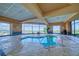 Relaxing indoor pool area with views of the mountains and city at 2872 Sumter Valley Cir, Henderson, NV 89052