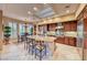 Gourmet kitchen showcases granite countertops, a central island and stainless steel appliances at 2872 Sumter Valley Cir, Henderson, NV 89052