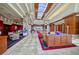 The elegant lobby features beautiful flooring, skylights, stone accents, and comfortable seating areas at 2872 Sumter Valley Cir, Henderson, NV 89052
