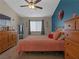 Bedroom featuring warm colors, ceiling fan, and generous closet space at 321 Yardarm Way, Las Vegas, NV 89145