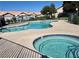 Community pool and jacuzzi area with a fence at 321 Yardarm Way, Las Vegas, NV 89145