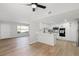 Bright, modern kitchen with white cabinets, stainless steel appliances, and stylish bar seating at 3345 Medina Ct, Las Vegas, NV 89121