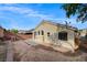 Backyard of home with patio, block wall, and desert landscaping at 3417 Steppe St, North Las Vegas, NV 89032