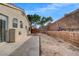 Backyard with concrete patio, block wall, and some desert landscaping at 3417 Steppe St, North Las Vegas, NV 89032