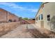 Backyard area with a block wall, concrete patio and easy landscaping possibilities at 3417 Steppe St, North Las Vegas, NV 89032