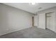 Bedroom featuring neutral walls, carpet, a closet, and a doorway at 3417 Steppe St, North Las Vegas, NV 89032