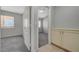 Carpeted bedroom with open door to another room at 3417 Steppe St, North Las Vegas, NV 89032